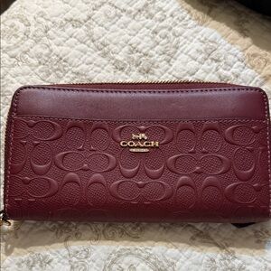 COACH Wine Embossed Signature Zip Wallet with Gold Hardware